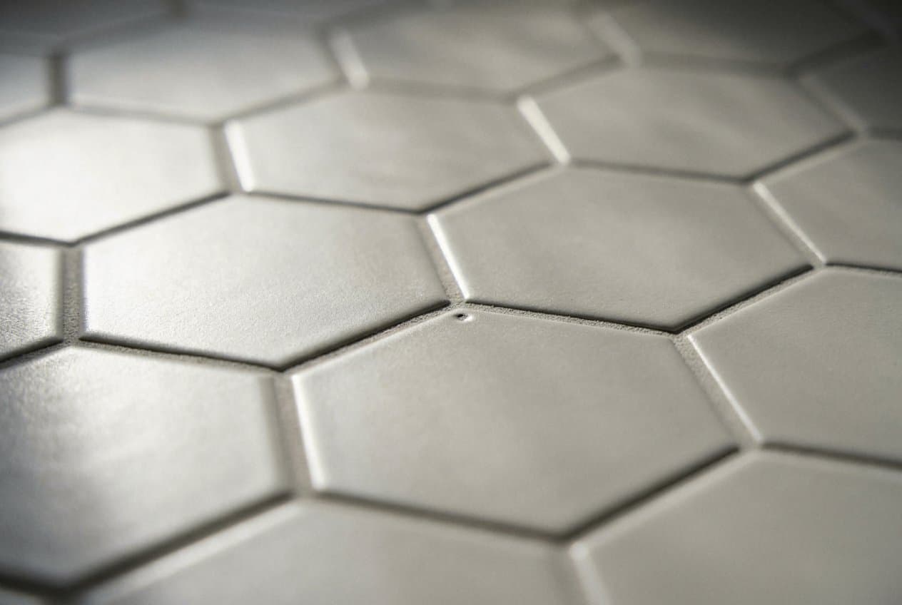 Close-up of clean gray hexagon tile grout lines