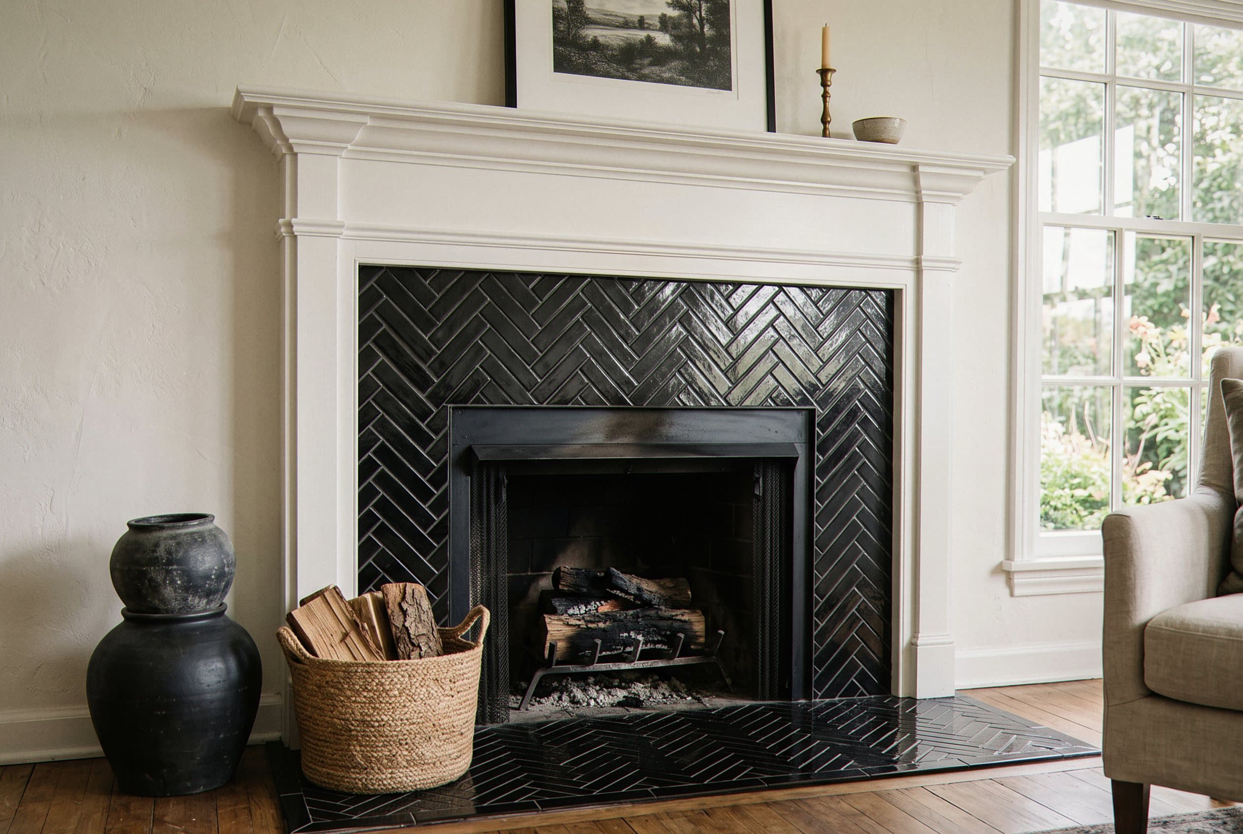 Black herringbone tile fireplace from floor to mantel